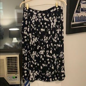 Pleated navy and white patterned skirt